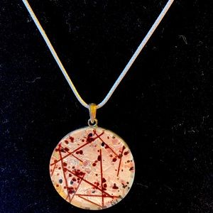 Stone pendant on leather cord